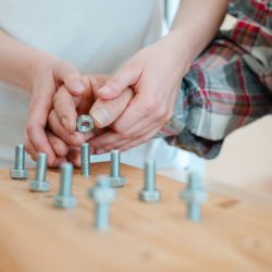 Closeup,On,Hand,Of,Man,In,Occupational,Therapy,Screwing,Nut